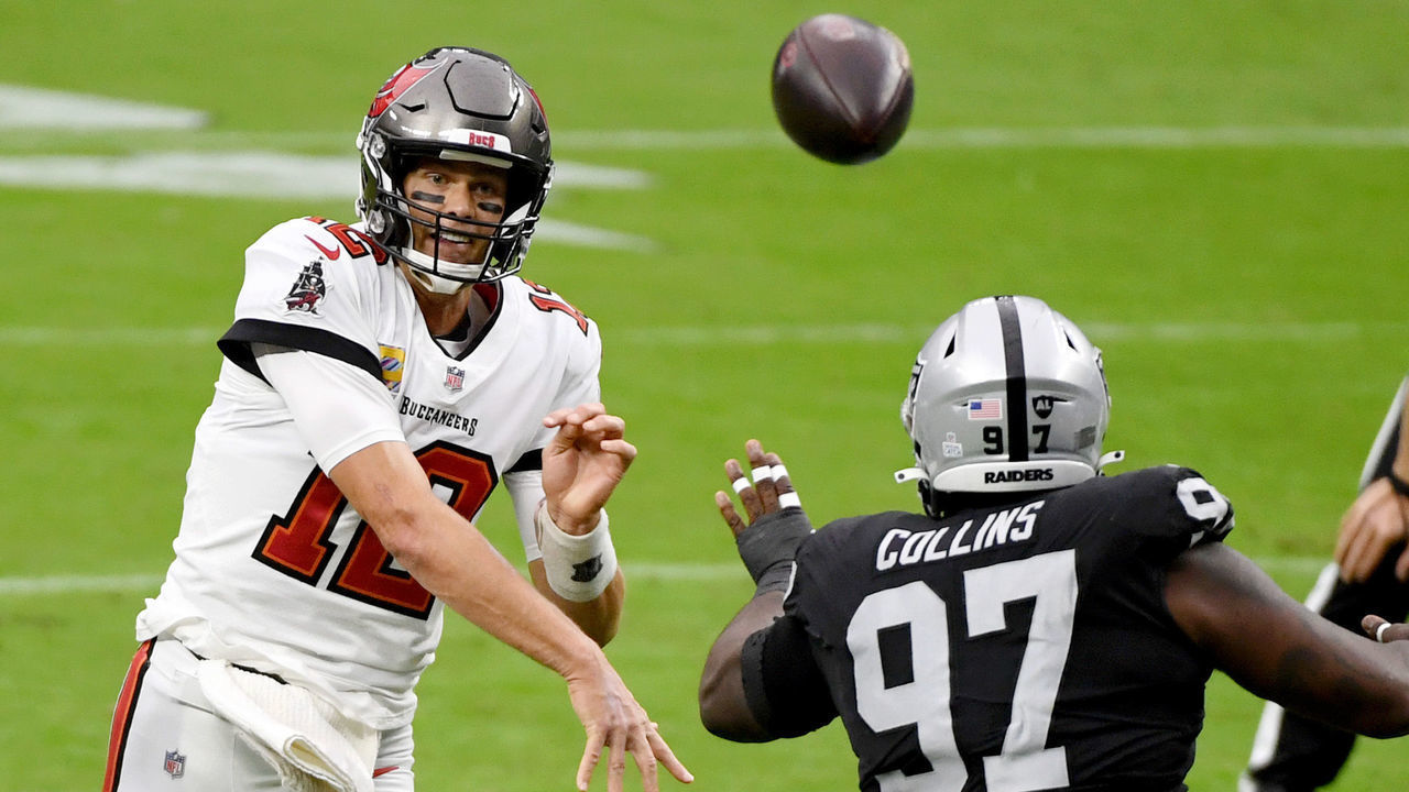 LAS VEGAS, NEVADA - OCTOBER 25: Quarterback Tom Brady #12 of the Tampa Bay Buccaneers throws under pressure from defensive tackle Maliek Collins #97 of the Las Vegas Raiders during the first half of their game at Allegiant Stadium on October 25, 2020 in Las Vegas, Nevada. The Buccaneers defeated the Raiders 45-20.