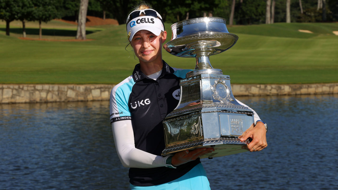 JOHNS CREEK, GEORGIA - JUNE 27: Nelly Korda poses with the trophy after putting in to win on the 18th green during the final round of the KPMG Women's PGA Championship at Atlanta Athletic Club on June 27, 2021 in Johns Creek, Georgia.