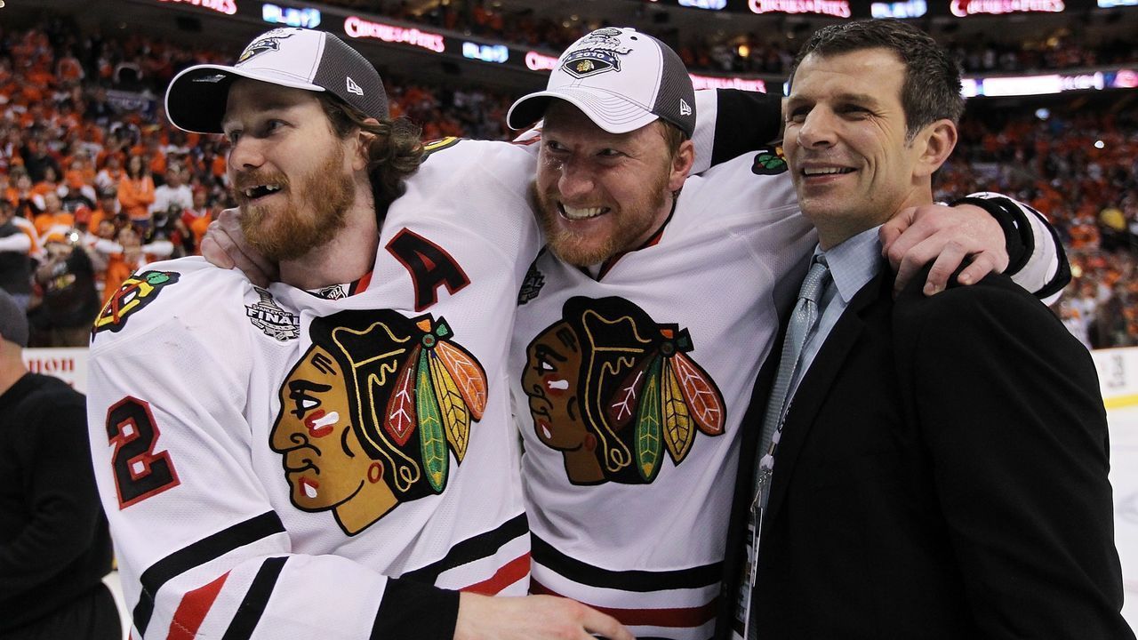 PHILADELPHIA - JUNE 09: (L-R) Duncan Keith #2, Marian Hossa #81, and Director of Player Personnel Marc Bergevin of the Chicago Blackhawks celebrate after the Blackhawks defeated the Philadelphia Flyers 4-3 in overtime to win the Stanley Cup in Game Six of the 2010 NHL Stanley Cup Final at the Wachovia Center on June 9, 2010 in Philadelphia, Pennsylvania.