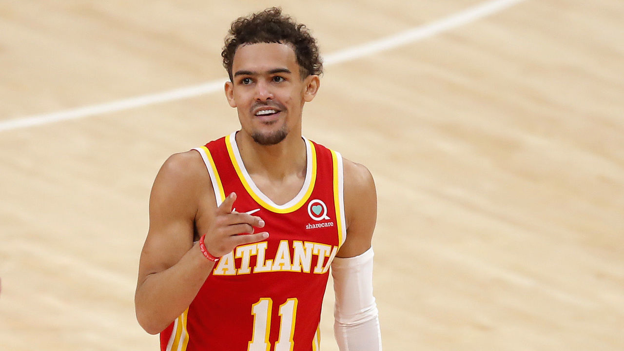 ATLANTA, GEORGIA - JUNE 27: Trae Young #11 of the Atlanta Hawks reacts after a three point basket against the Milwaukee Bucks during the first half in game three of the Eastern Conference Finals at State Farm Arena on June 27, 2021 in Atlanta, Georgia.