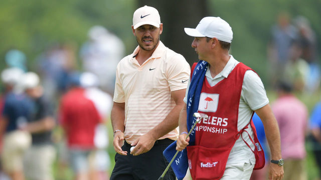 CROMWELL, CONNECTICUT - JUNE 27: Brooks Koepka of the United States talks with his caddie Ricky Elliott on the fourth green during the final round of the Travelers Championship at TPC River Highlands on June 27, 2021 in Cromwell, Connecticut.