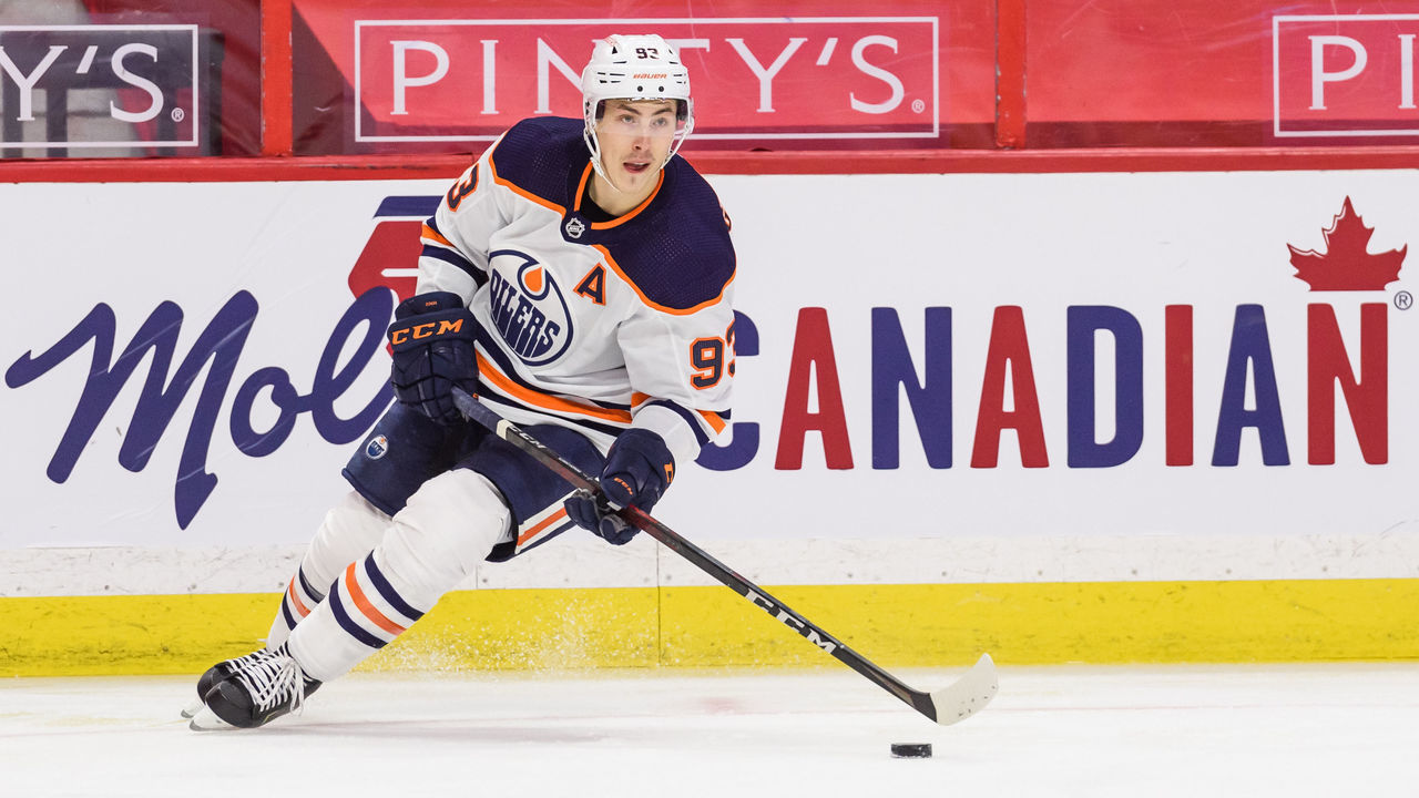 OTTAWA, ON - APRIL 07: Edmonton Oilers Left Wing Ryan Nugent-Hopkins (93) controls the puck along the boards during the second period of the NHL game between the Ottawa Senators and the Edmonton Oilers on April 07, 2021 at the Canadian Tire Centre in Ottawa, Ontario, Canada.