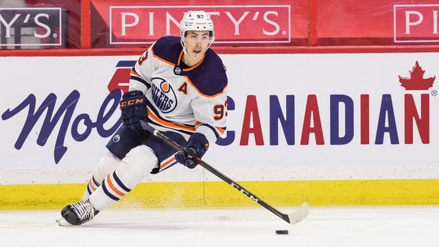 OTTAWA, ON - APRIL 07: Edmonton Oilers Left Wing Ryan Nugent-Hopkins (93) controls the puck along the boards during the second period of the NHL game between the Ottawa Senators and the Edmonton Oilers on April 07, 2021 at the Canadian Tire Centre in Ottawa, Ontario, Canada.