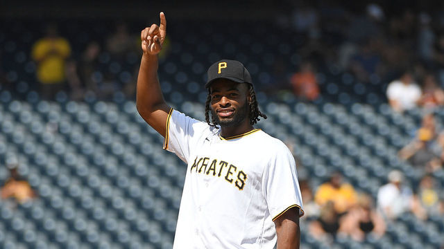PITTSBURGH, PA - JUNE 05: Pittsburgh Steelers First Round Pick Najee Harris waves to the crowd before throwing out the first pitch before the start of the game between the Pittsburgh Pirates and the Miami Marlins at PNC Park on June 5, 2021 in Pittsburgh, Pennsylvania.