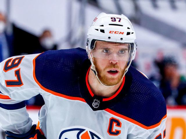WINNIPEG, MB - MAY 24: Connor McDavid #97 of the Edmonton Oilers prepares for a second period face-off against the Winnipeg Jets in Game Four of the First Round of the 2021 Stanley Cup Playoffs at Bell MTS Place on May 24, 2021 in Winnipeg, Manitoba.
