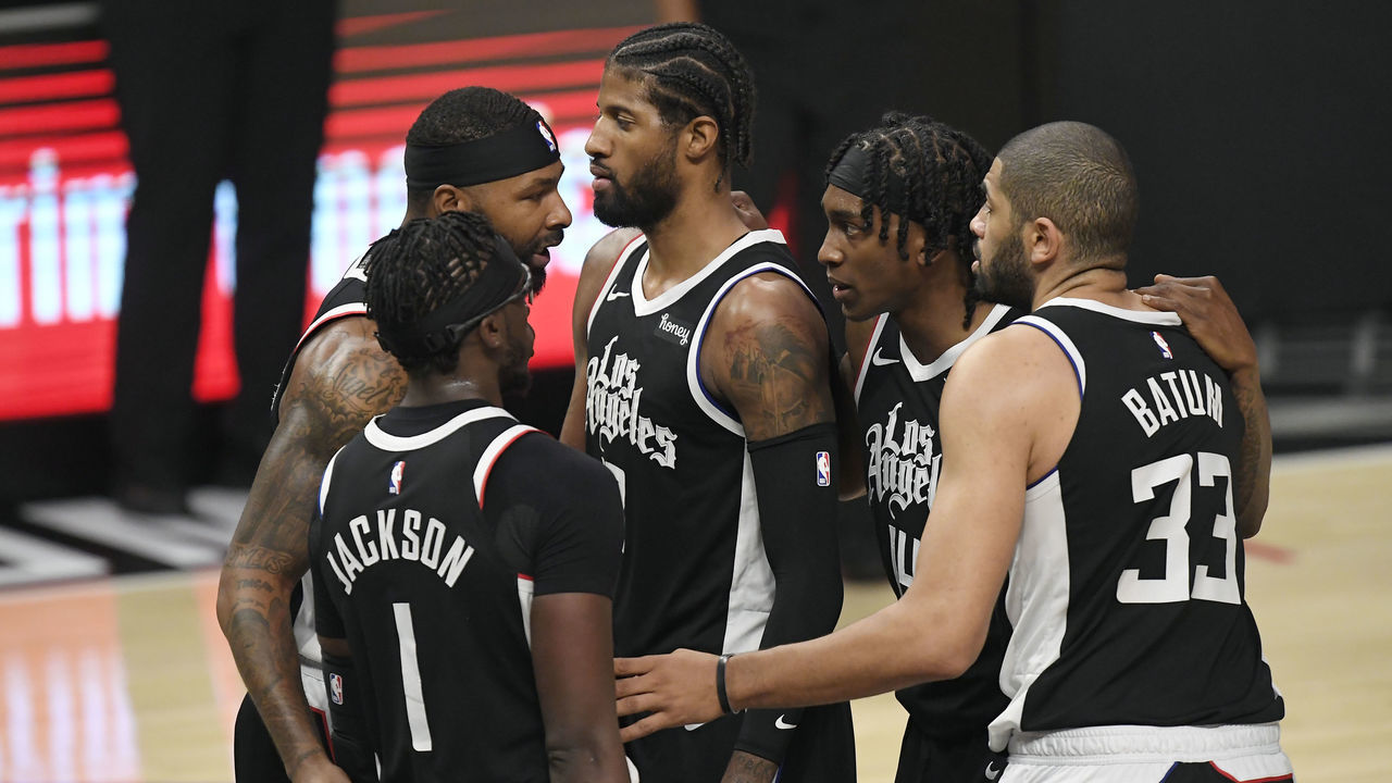 LOS ANGELES, CA - JUNE 18: Reggie Jackson #1 of the Los Angeles Clippers, Marcus Morris Sr. #8, Paul George #13, Terance Mann #14, and Nicolas Batum #33 of the Los Angeles Clippers huddle during the second half against Utah Jazz in Game Six of the Western Conference second-round playoff series at Staples Center on June 18, 2021 in Los Angeles, California.