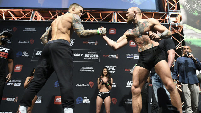 ABU DHABI, UNITED ARAB EMIRATES - JANUARY 22: (L-R) Opponents Dustin Poirier and Conor McGregor of Ireland face off during the UFC 257 weigh-in at Etihad Arena on UFC Fight Island on January 22, 2021 in Abu Dhabi, United Arab Emirates.