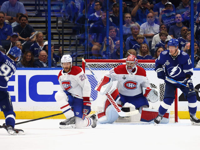 TAMPA, FLORIDA - JUNE 28: Jon Merrill #28 and Carey Price #31 of the Montreal Canadiens defend against Steven Stamkos #91 of the Tampa Bay Lightning during Game One of the 2021 NHL Stanley Cup Finals against the Tampa Bay Lightning at Amalie Arena on June 28, 2021 in Tampa, Florida.