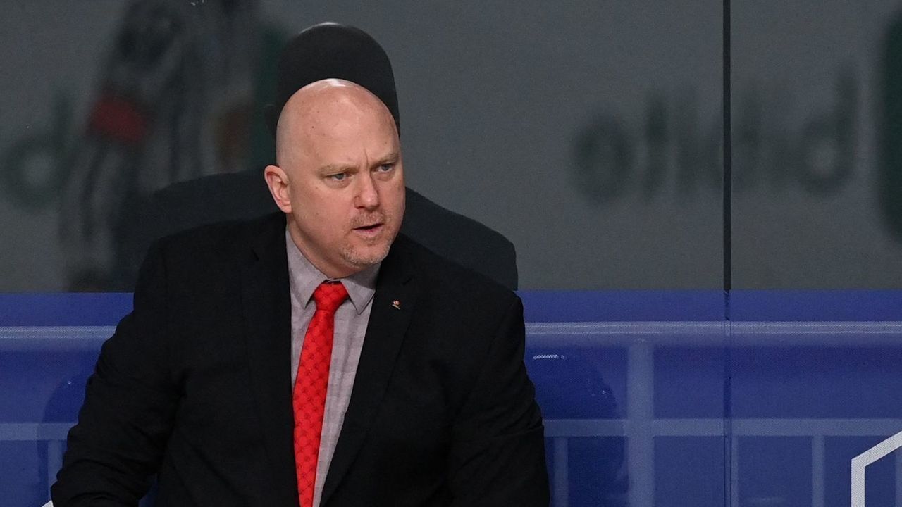 Canada's head coach Gerard Gallant (back C) gestures next to Canada's assistant coach Michael Kelly (back R) and Canada's assistant coach Andre Tourigny (back L) during the IIHF Men's Ice Hockey World Championships final match between the Finland and Canada at the Arena Riga in Riga, Latvia, on June 5, 2021.