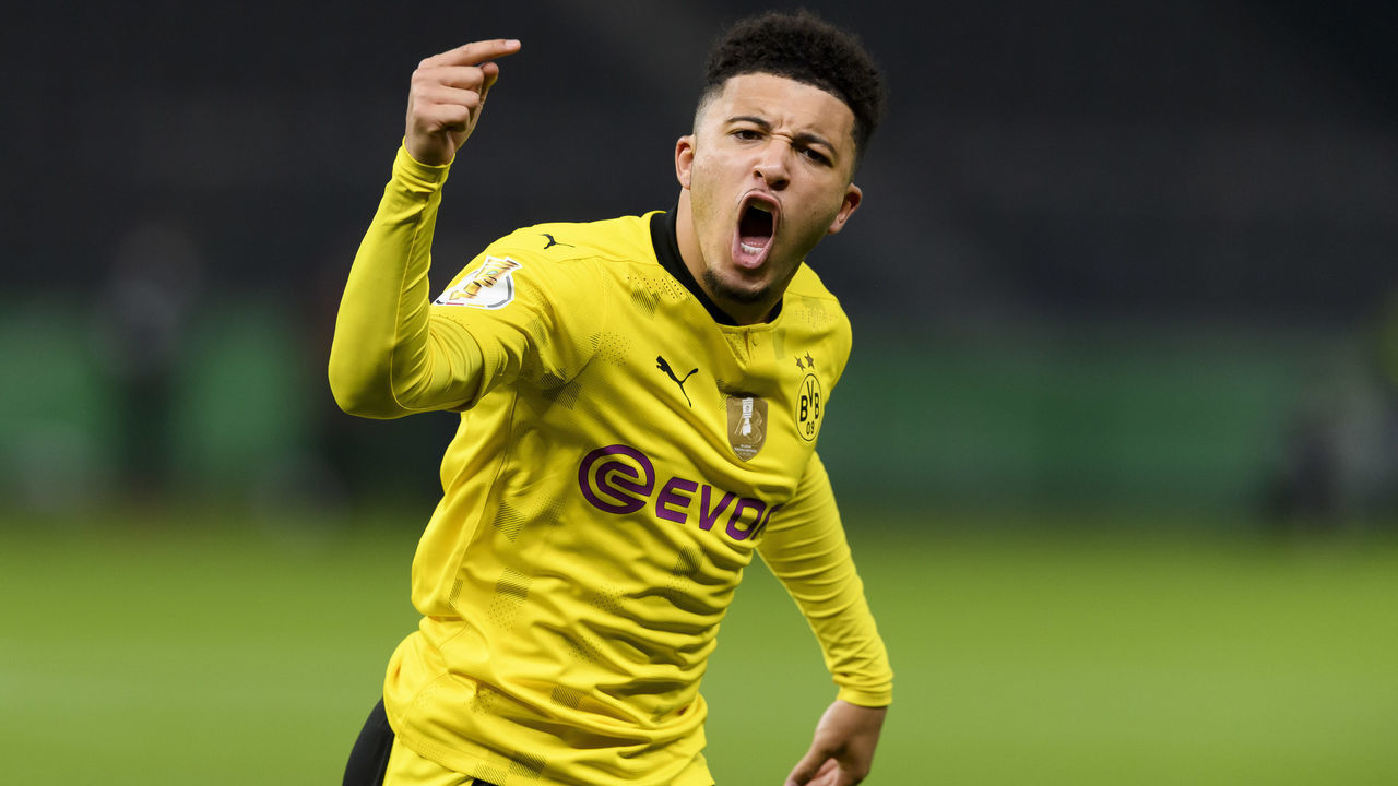 BERLIN, GERMANY - MAY 13: (BILD ZEITUNG OUT) Jadon Sancho of Borussia Dortmund celebrates after scoring his team's first goal during the DFB Cup final match between RB Leipzig and Borussia Dortmund at Olympic Stadium on May 13, 2021 in Berlin, Germany. Sporting stadiums around Germany remain under strict restrictions due to the Coronavirus Pandemic as Government social distancing laws prohibit fans inside venues resulting in games being played behind closed doors.