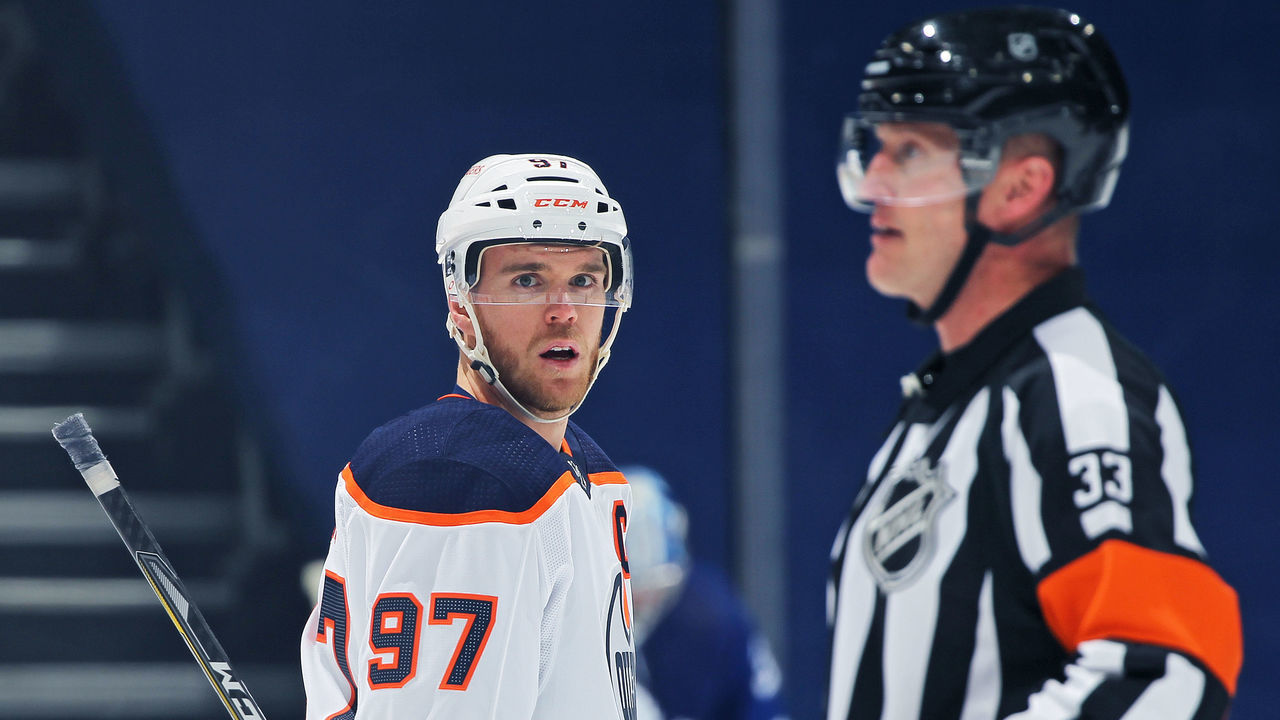 TORONTO, ON - MARCH 27: Connor McDavid #97 of the Edmonton Oilers watches as referee Kevin Pollock #33 allows a goal during action against the Toronto Maple Leafs in an NHL game at Scotiabank Arena on March 27, 2021 in Toronto, Ontario, Canada. The Maple Leafs defeated the Oilers 4-3 in overtime.