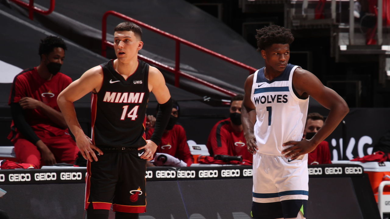 MIAMI, FL - MAY 7: Tyler Herro #14 of the Miami Heat and Anthony Edwards #1 of the Minnesota Timberwolves looks on during the game on May 7, 2021 at American Airlines Arena in Miami, Florida. Mandatory Copyright Notice: Copyright 2021 NBAE