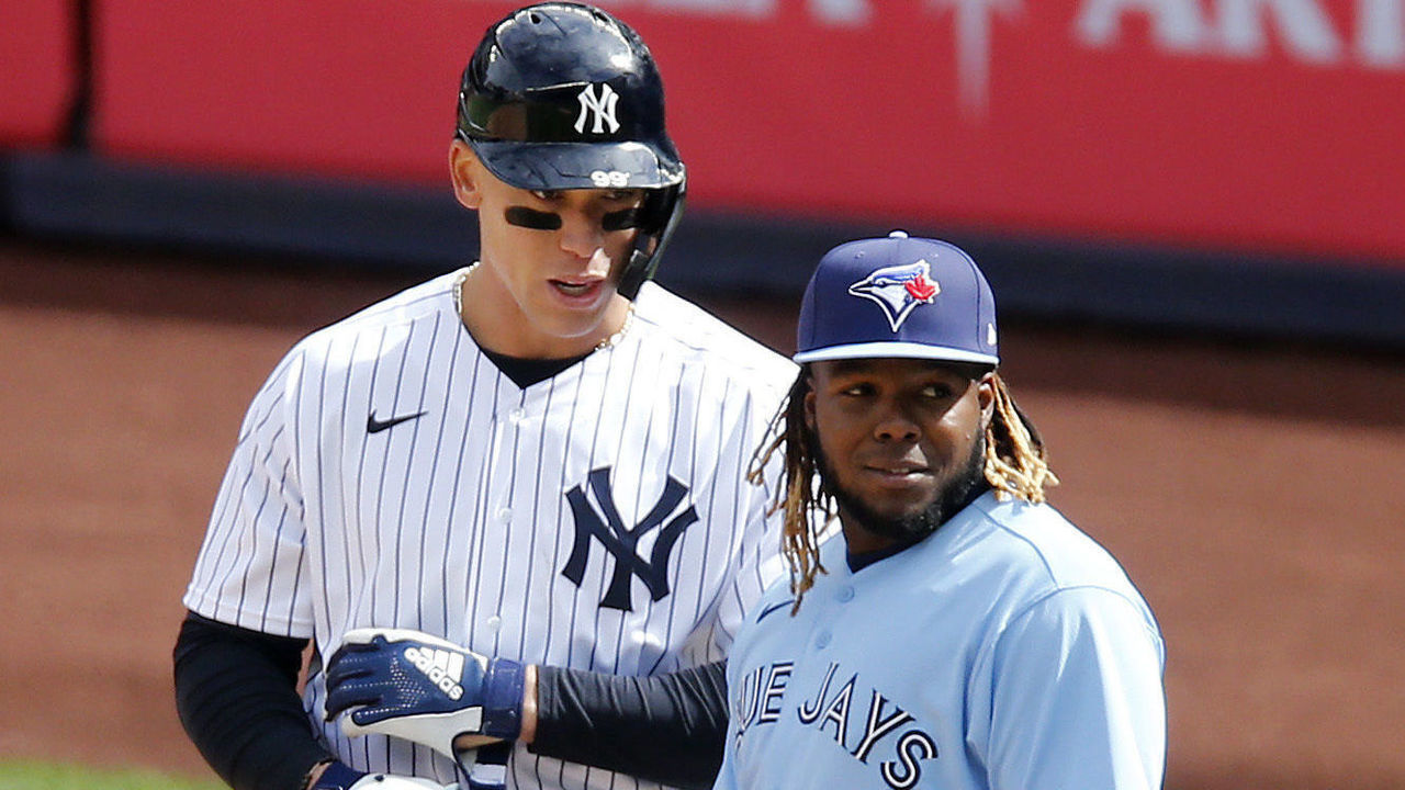 NEW YORK, NEW YORK - APRIL 01: (NEW YORK DAILIES OUT) Aaron Judge #99 of the New York Yankees in action against Vladimir Guerrero Jr. #27 of the Toronto Blue Jays at Yankee Stadium on April 01, 2021 in New York City. The Blue Jays defeated the Yankees 3-2 in ten innings.