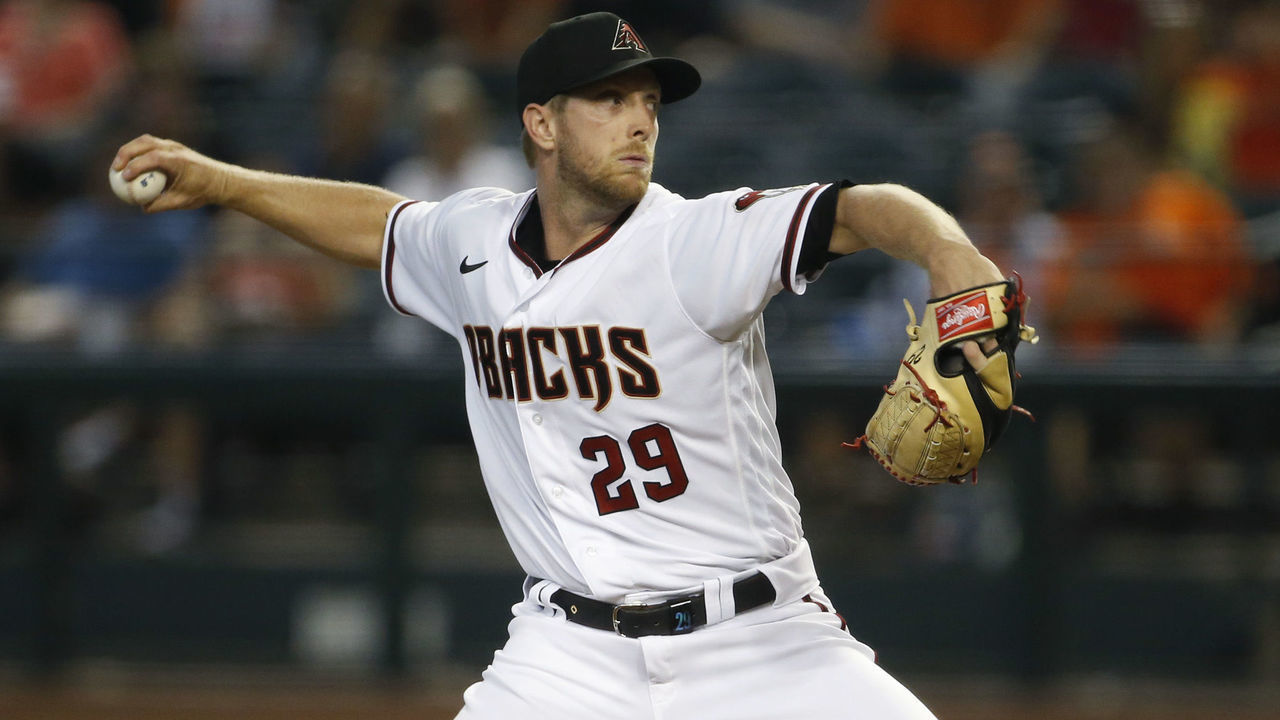 PHOENIX, ARIZONA - JULY 01: Starting pitcher Merrill Kelly #29 of the Arizona Diamondbacks throws against the San Francisco Giants during the first inning of the MLB game at Chase Field on July 01, 2021 in Phoenix, Arizona.