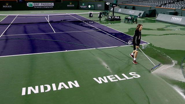 INDIAN WELLS, CALIFORNIA - MARCH 08: Courtmaster Jeffrey Brooker cleans the center court at the Indian Wells Tennis Garden on March 08, 2020 in Indian Wells, California. The BNP Paribas Open was cancelled by the Riverside County Public Health Department, as county officials declared a public health emergency when a case of coronavirus (COVID-19) was confirmed in the area.