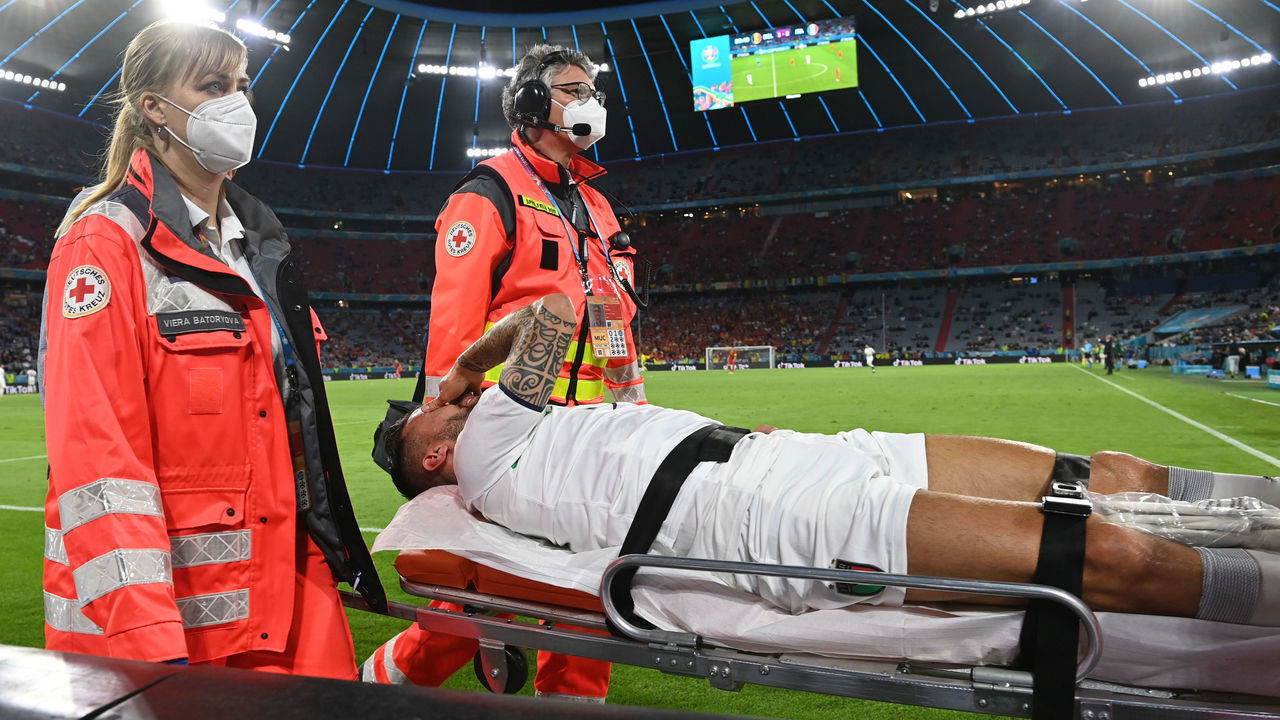 MUNICH, GERMANY - JULY 02: Leonardo Spinazzola of Italy leaves the pitch on a stretcher during the UEFA Euro 2020 Championship Quarter-final match between Belgium and Italy at Football Arena Munich on July 02, 2021 in Munich, Germany.