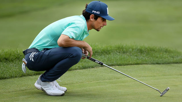 DETROIT, MICHIGAN - JULY 02: Joaquin Niemann of Chile lines up a putt on the 17th green during the second round of the Rocket Mortgage Classic on July 02, 2021 at the Detroit Golf Club in Detroit, Michigan.