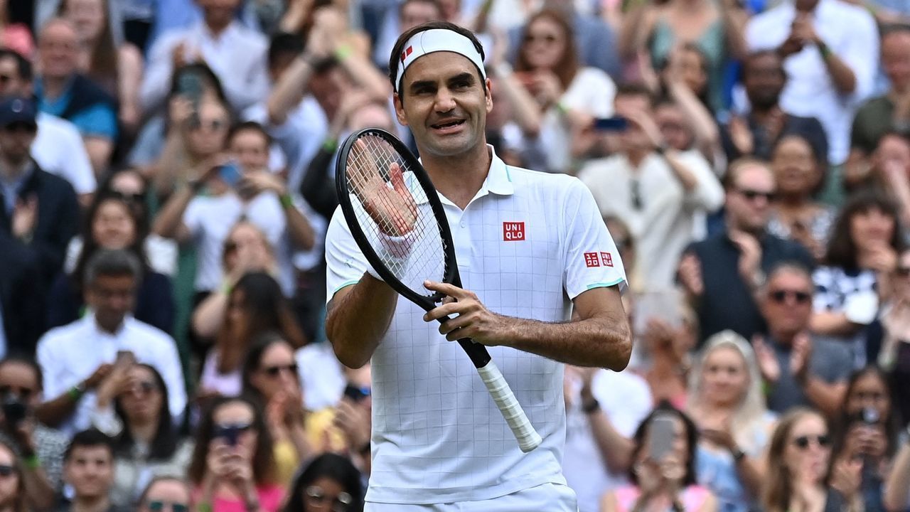 Switzerland's Roger Federer celebrates his victory over Britain's Cameron Norrie during their men's singles third round match on the sixth day of the 2021 Wimbledon Championships at The All England Tennis Club in Wimbledon, southwest London, on July 3, 2021. - RESTRICTED TO EDITORIAL USE