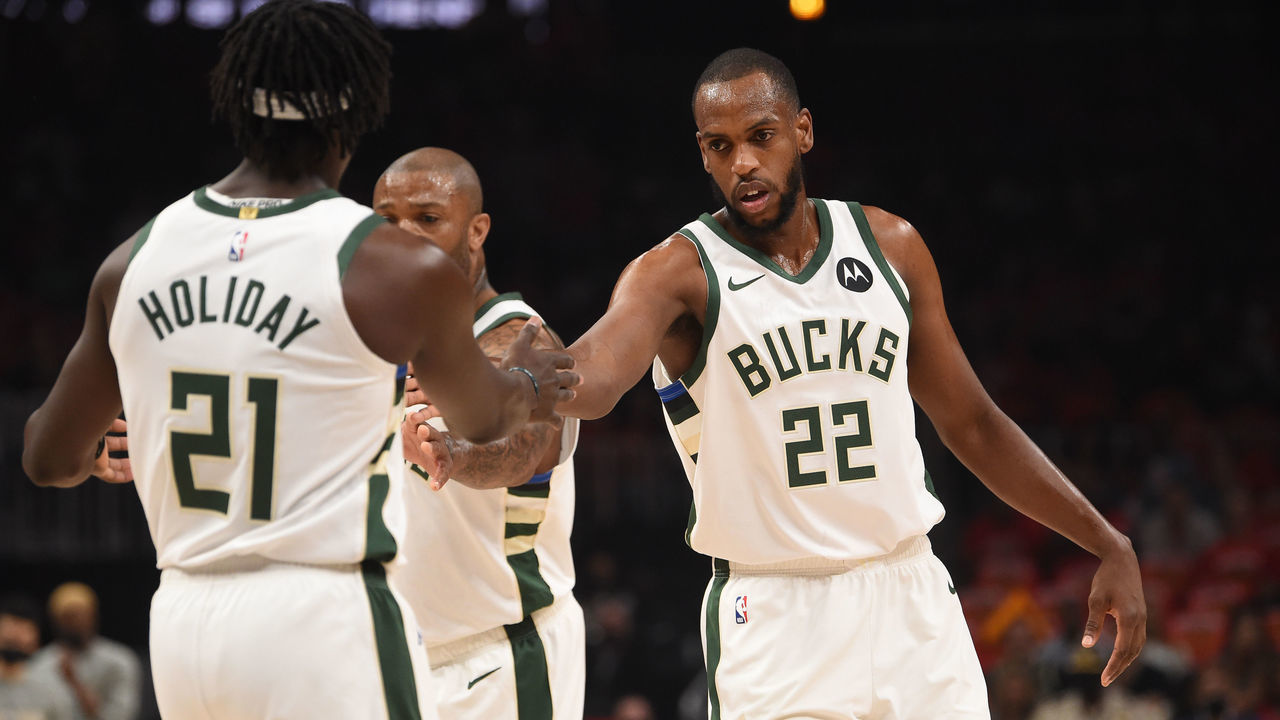 ATLANTA, GA - JULY 3: Khris Middleton #22 of the Milwaukee Bucks high-fives teammate Jrue Holiday #21 during the game against the Atlanta Hawks during Game 6 of the Eastern Conference Finals of the 2021 NBA Playoffs on July 3, 2021 at State Farm Arena in Atlanta, Georgia. NOTE TO USER: User expressly acknowledges and agrees that, by downloading and/or using this Photograph, user is consenting to the terms and conditions of the Getty Images License Agreement. Mandatory Copyright Notice: Copyright 2021 NBAE