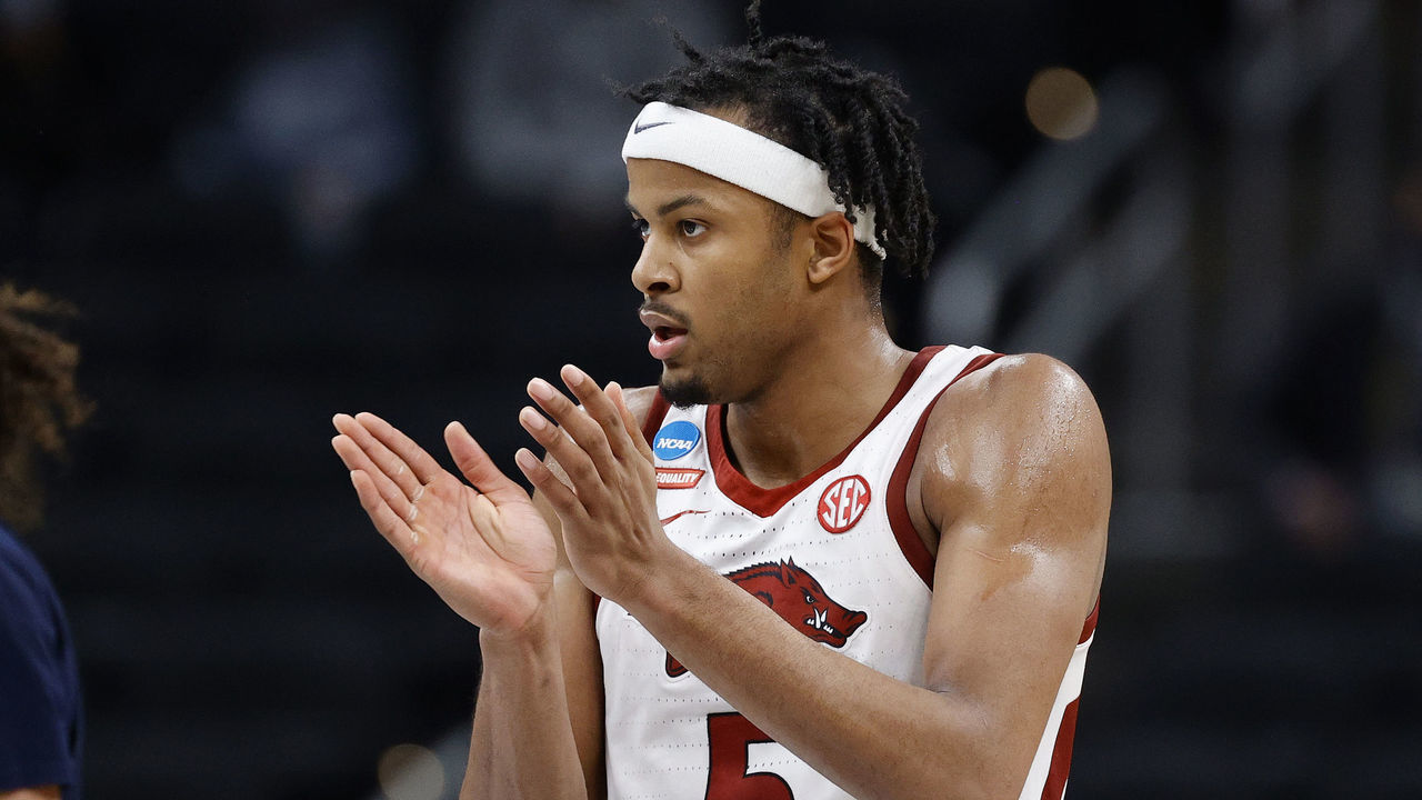 INDIANAPOLIS, INDIANA - MARCH 27: Moses Moody #5 of the Arkansas Razorbacks reacts after a call against the Oral Roberts Golden Eagles during the second half in the Sweet Sixteen round of the 2021 NCAA Men's Basketball Tournament at Bankers Life Fieldhouse on March 27, 2021 in Indianapolis, Indiana.