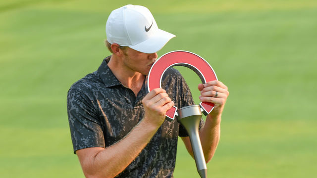 DETROIT, MI - JULY 04: Cam Davis (AUS) kisses the trophy after winning the the Rocket Mortgage Classic at Detroit Golf Club on July 4, 2021 in Detroit, Michigan.