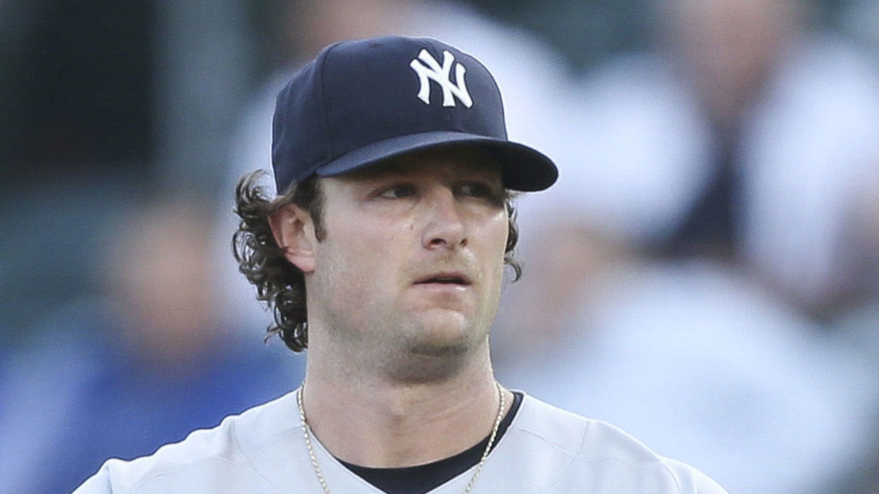 BUFFALO, NEW YORK - JUNE 16: Gerrit Cole #45 of the New York Yankees rubs the ball between pitches during the second inning against the Toronto Blue Jays at Sahlen Field on June 16, 2021 in Buffalo, New York.