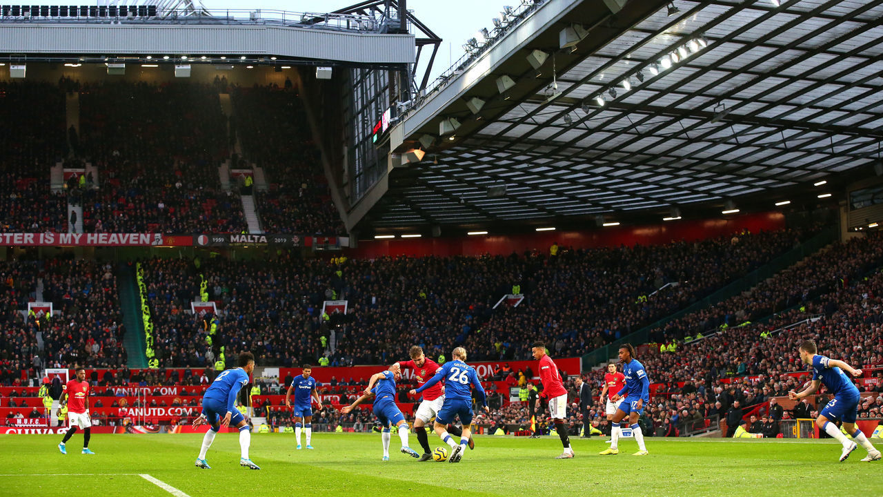 MANCHESTER, ENGLAND - DECEMBER 15: General view inside the stadium as Luke Shaw of Manchester United battles for possession with Richarlison and Tom Davies of Everton during the Premier League match between Manchester United and Everton FC at Old Trafford on December 15, 2019 in Manchester, United Kingdom.