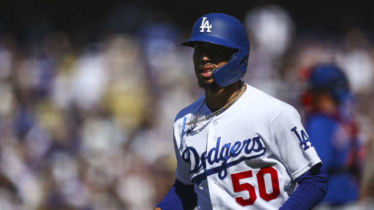 LOS ANGELES, CALIFORNIA - JUNE 26: Mookie Betts #50 of the Los Angeles Dodgers looks on after scoring a run in the first inning off a hit by Max Muncy #13 (not in photo) against the Chicago Cubs at Dodger Stadium on June 26, 2021 in Los Angeles, California.
