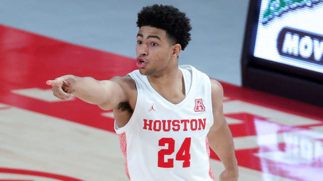 HOUSTON, TEXAS - FEBRUARY 21: Quentin Grimes #24 of the Houston Cougars reacts after a basket during the first half of a game against the Cincinnati Bearcats at the Fertitta Center on February 21, 2021 in Houston, Texas.