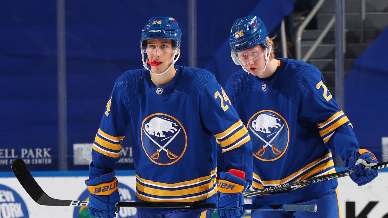 BUFFALO, NY - APRIL 17: Dylan Cozens #24 and Rasmus Dahlin #26 of the Buffalo Sabres prepare for a faceoff during an NHL game against the Pittsburgh Penguins on April 17, 2021 at KeyBank Center in Buffalo, New York.