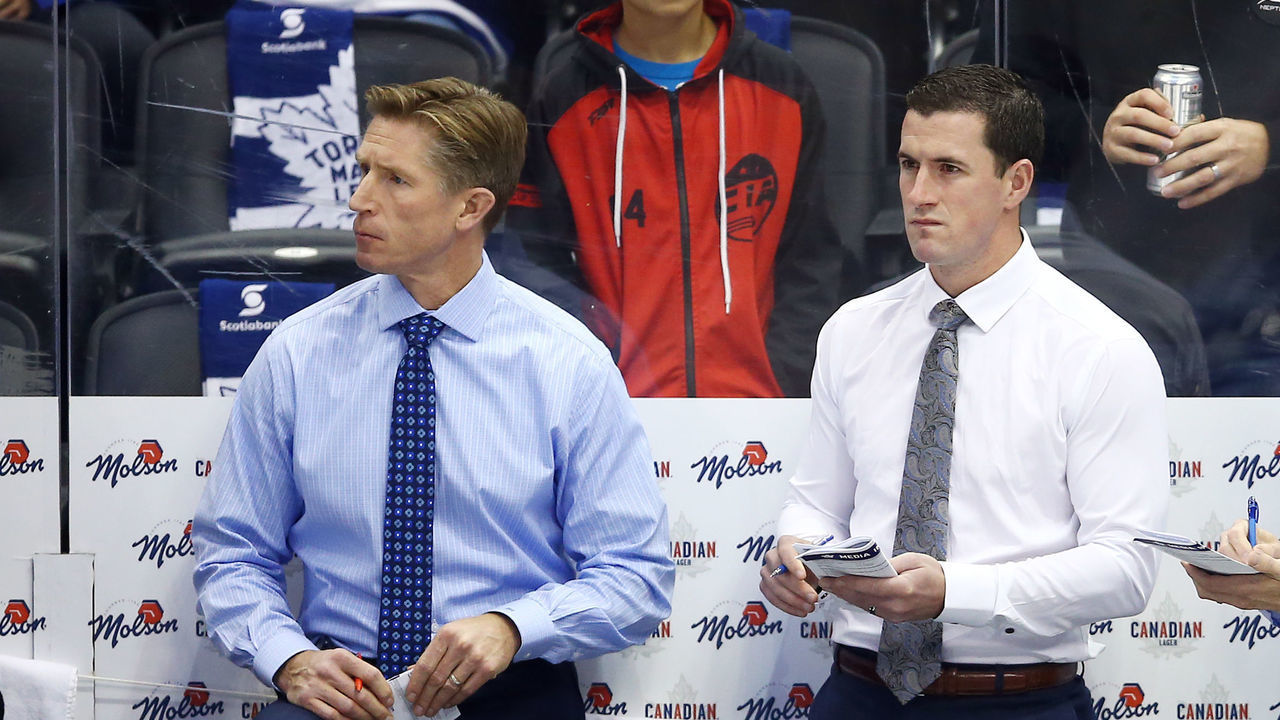 TORONTO, ON - OCTOBER 02: Assistant Coaches Dave Hakstol, Paul McFarland and Head Coach Mike Babcock of the Toronto Maple Leafs look on from the bench prior to an NHL game against the Ottawa Senators at Scotiabank Arena on October 2, 2019 in Toronto, Canada.