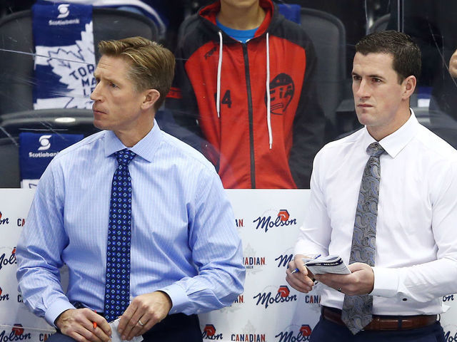 TORONTO, ON - OCTOBER 02: Assistant Coaches Dave Hakstol, Paul McFarland and Head Coach Mike Babcock of the Toronto Maple Leafs look on from the bench prior to an NHL game against the Ottawa Senators at Scotiabank Arena on October 2, 2019 in Toronto, Canada.