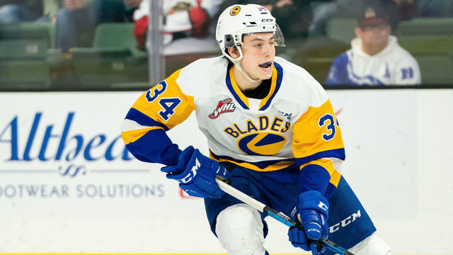 EVERETT, WASHINGTON - NOVEMBER 22: Saskatoon Blades forward Colton Dach #34 waits for a pass at the blue line during the third period of a game between the Everett Silvertips and the Saskatoon Blades at Angel of the Winds Arena on November 22, 2019 in Everett, Washington.