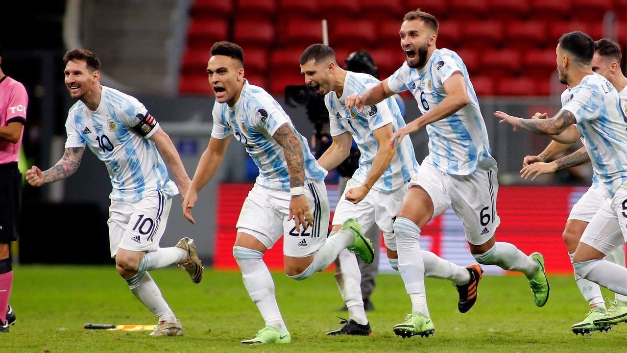 Argentine players celebrate at the end of the Conmebol 2021 Copa America football tournament semi-final match against Colombia at the Mane Garrincha Stadium in Brasilia, Brazil, on July 6, 2021.