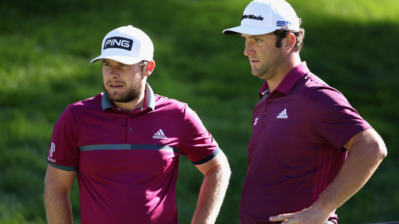 LAS VEGAS, NEVADA - OCTOBER 15: Tyrrell Hatton of England and Jon Rahm of Spain talk on the eighth green during the first round of the CJ Cup @ Shadow Creek on October 15, 2020 in Las Vegas, Nevada.