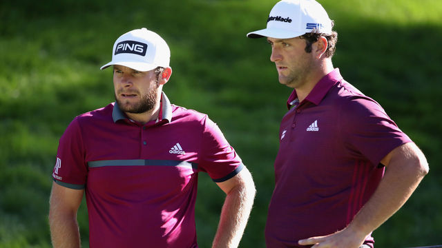 LAS VEGAS, NEVADA - OCTOBER 15: Tyrrell Hatton of England and Jon Rahm of Spain talk on the eighth green during the first round of the CJ Cup @ Shadow Creek on October 15, 2020 in Las Vegas, Nevada.