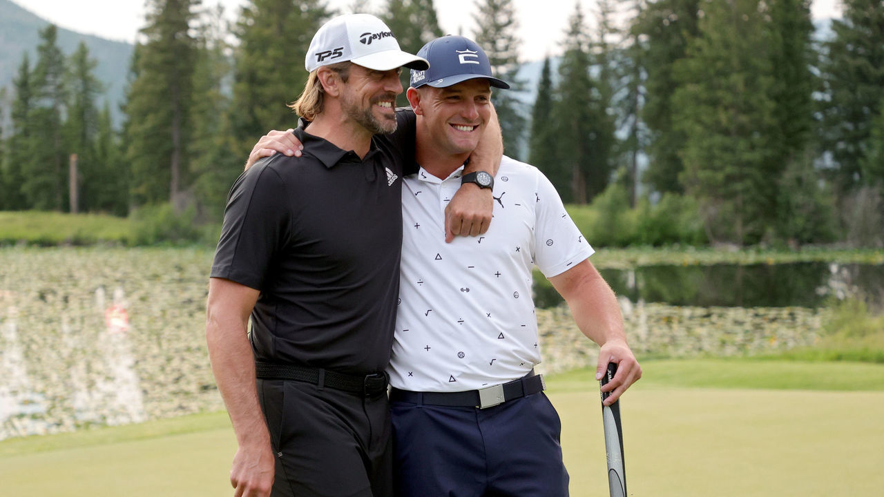 BIG SKY, MONTANA - JULY 06: Aaron Rodgers (L) and Bryson DeChambeau celebrate after winning Capital One's The Match at The Reserve at Moonlight Basin on July 06, 2021 in Big Sky, Montana.