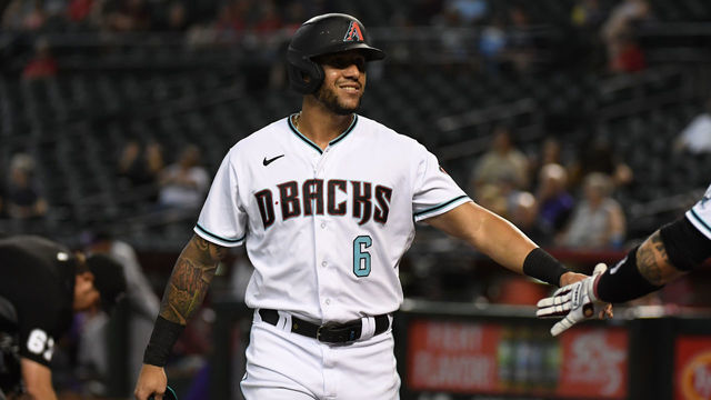 PHOENIX, ARIZONA - JULY 06: David Peralta #6 of the Arizona Diamondbacks celebrates with Christian Walker #53 after scoring on an RBI double by Eduardo Escobar #5 against the Colorado Rockies during the first inning at Chase Field on July 06, 2021 in Phoenix, Arizona.