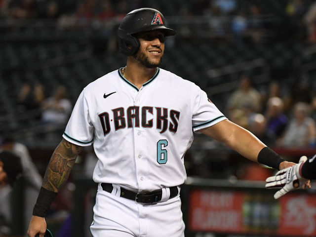 PHOENIX, ARIZONA - JULY 06: David Peralta #6 of the Arizona Diamondbacks celebrates with Christian Walker #53 after scoring on an RBI double by Eduardo Escobar #5 against the Colorado Rockies during the first inning at Chase Field on July 06, 2021 in Phoenix, Arizona.