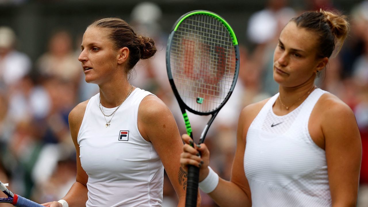 Czech Republic's Karolina Pliskova (L) celebrates winning against Belarus's Aryna Sabalenka during their women's semi-final match on the tenth day of the 2021 Wimbledon Championships at The All England Tennis Club in Wimbledon, southwest London, on July 8, 2021. - RESTRICTED TO EDITORIAL USE