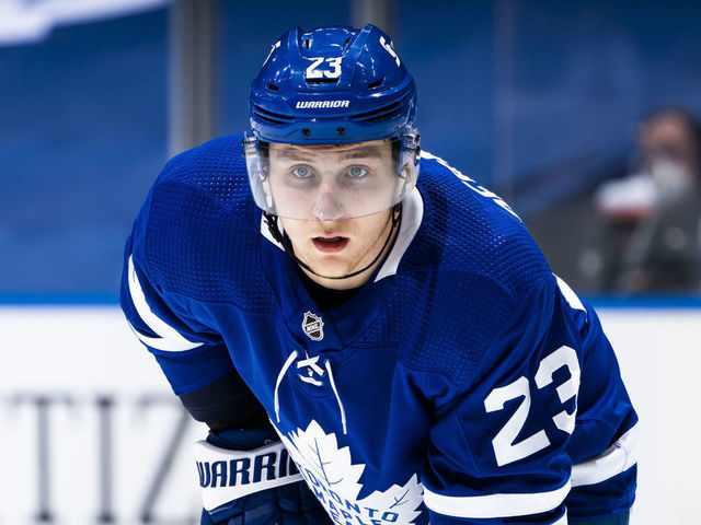 TORONTO, ON - APRIL 29: Travis Dermott #23 of the Toronto Maple Leafs looks on against the Vancouver Canucks during the third period at the Scotiabank Arena on April 29, 2021 in Toronto, Ontario, Canada.