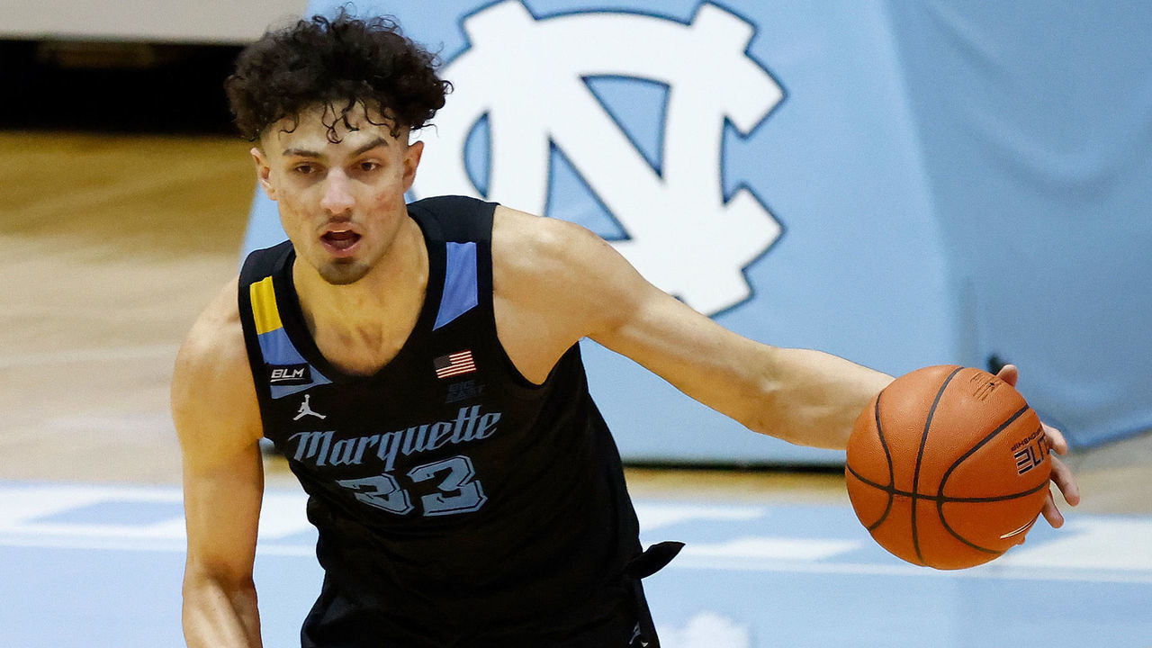 CHAPEL HILL, NORTH CAROLINA - FEBRUARY 24: Dawson Garcia #33 of the Marquette Golden Eagles drives the ball against the North Carolina Tar Heels during their game at the Dean Smith Center on February 24, 2021 in Chapel Hill, North Carolina. Marquette won 83-70.