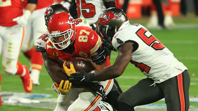 TAMPA, FLORIDA - FEBRUARY 07: Jason Pierre-Paul #90 and Lavonte David #54 of the Tampa Bay Buccaneers tackles Travis Kelce #87 of the Kansas City Chiefs during the second quarter in Super Bowl LV at Raymond James Stadium on February 07, 2021 in Tampa, Florida.