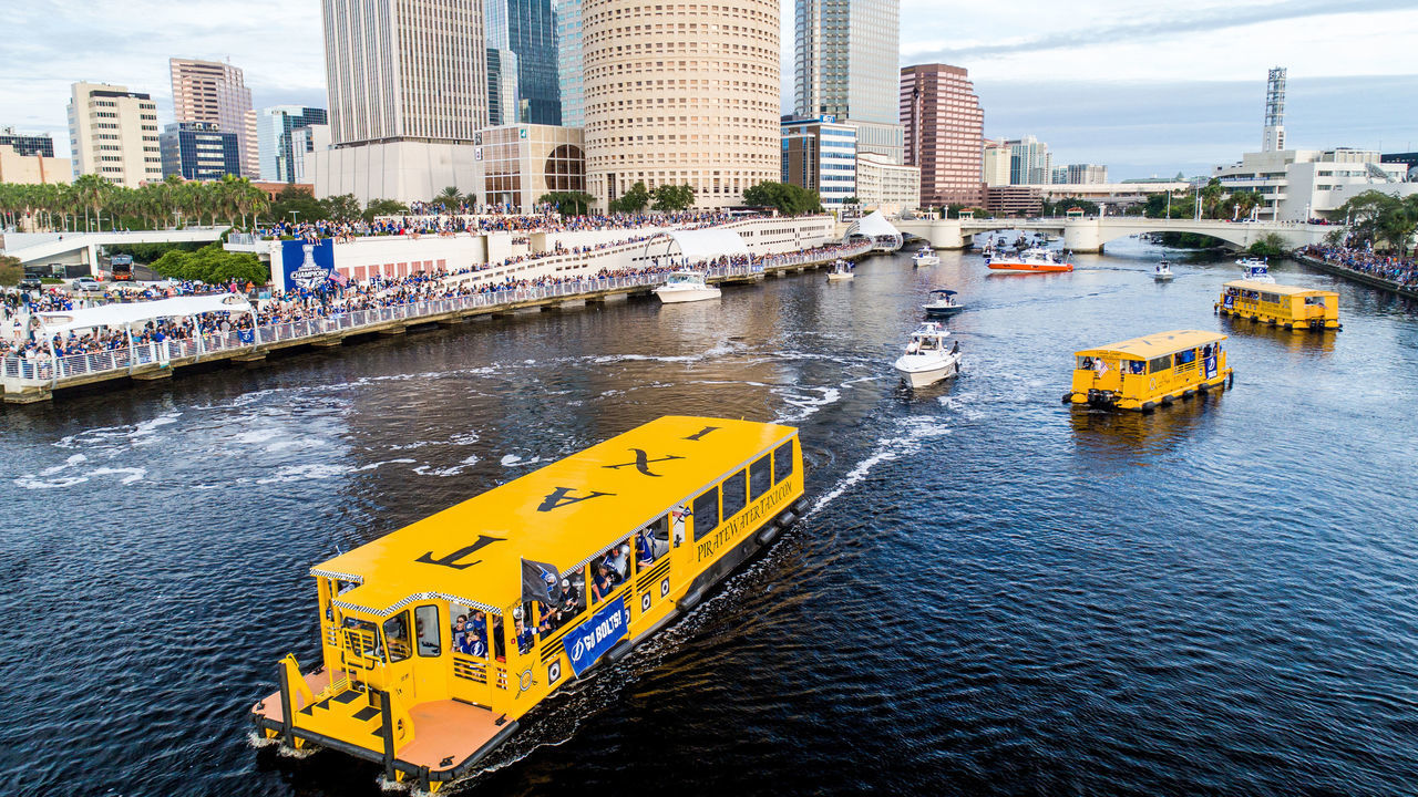 TAMPA, FLORIDA - SEPTEMBER 30: A taxi boat carrying fans cruises by Curtis Hixon park during the Tampa Bay Lightning Victory Rally & Boat Parade on the Hillsborough river on September 30, 2020 in Tampa, Florida.