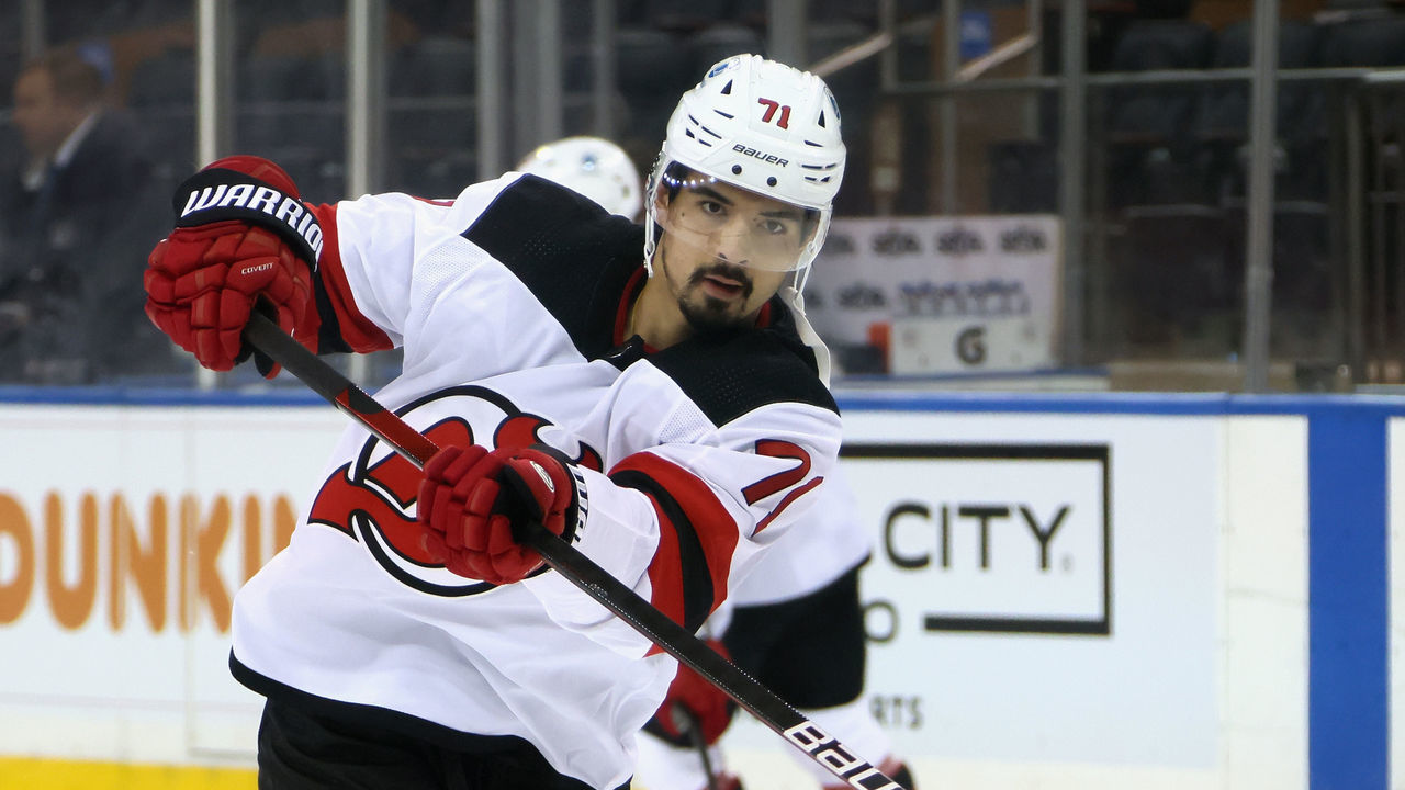 NEW YORK, NEW YORK - APRIL 15: Jonas Siegenthaler #71 of the New Jersey Devils takes the shot during warm-ups prior to the game against the New York Rangers at Madison Square Garden on April 15, 2021 in New York City.