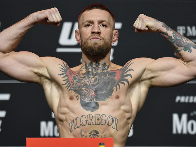 LAS VEGAS, NEVADA - JULY 09: Conor McGregor of Ireland poses on the scale during the UFC 264 official weigh-in at UFC APEX on July 09, 2021 in Las Vegas, Nevada.
