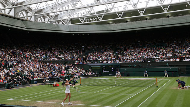 LONDON, ENGLAND - JULY 06: A general view of centre court as Ajla Tomljanovic of Australia serves in her Ladies' Singles Quarter-Final match against Ashleigh Barty of Australia during Day Eight of The Championships - Wimbledon 2021 at All England Lawn Tennis and Croquet Club on July 06, 2021 in London, England.