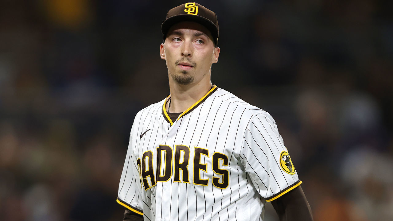 SAN DIEGO, CALIFORNIA - JUNE 22: Blake Snell #4 of the San Diego Padres looks on after allowing a single to AJ Pollock #11 of the Los Angeles Dodgers during the fourth inning of a game at PETCO Park on June 22, 2021 in San Diego, California.
