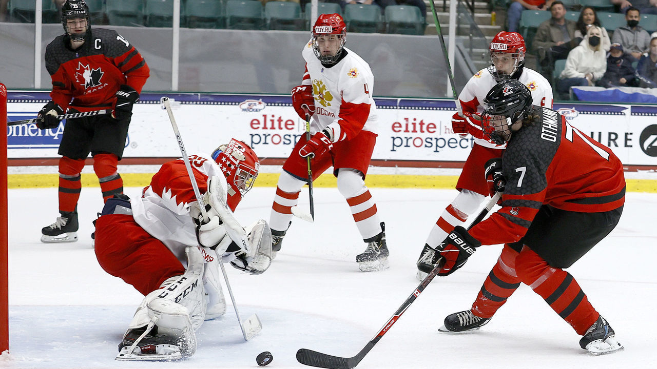 FRISCO, TEXAS - MAY 06: Brennan Othmann #7 of Canada puts a shot on goal against Sergei Ivanov #29 of Russia in the first period during the 2021 IIHF Ice Hockey U18 World Championship Gold Medal Game at Comerica Center on May 06, 2021 in Frisco, Texas.
