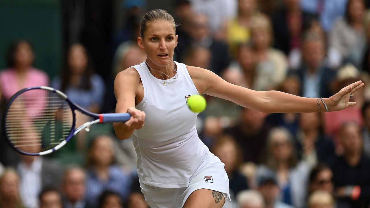 Czech Republic's Karolina Pliskova returns against Australia's Ashleigh Barty during their women's singles final match on the twelfth day of the 2021 Wimbledon Championships at The All England Tennis Club in Wimbledon, southwest London, on July 10, 2021. - RESTRICTED TO EDITORIAL USE